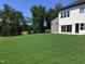 Expansive, verdant backyard with a view of mature trees, perfect for outdoor activities at 1404 Malcus Ct # 56, Fuquay Varina, NC 27526