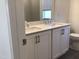 Bathroom featuring a double sink vanity with a white countertop and dark tile flooring at 1404 Malcus Ct # 56, Fuquay Varina, NC 27526