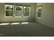 Sun-filled bedroom with plush carpeting, large windows offering serene views and ample light at 1404 Malcus Ct # 56, Fuquay Varina, NC 27526