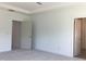 Empty bedroom, ready to be personalized, features new carpeting and bright, open doorways at 1404 Malcus Ct # 56, Fuquay Varina, NC 27526