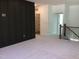Bonus room showcasing the charcoal accent wall and neutral carpeting at 1404 Malcus Ct # 56, Fuquay Varina, NC 27526