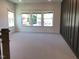 Bright bonus room featuring multiple windows and neutral carpeting at 1404 Malcus Ct # 56, Fuquay Varina, NC 27526