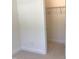 Open closet with carpet floors and shelving at 1404 Malcus Ct # 56, Fuquay Varina, NC 27526