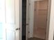 A bright closet with storage shelves and access to the walk-in closet with rod and shelf at 1404 Malcus Ct # 56, Fuquay Varina, NC 27526