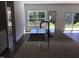 Kitchen island with granite countertop and brass faucet with view of the backyard at 1404 Malcus Ct # 56, Fuquay Varina, NC 27526