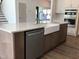 Kitchen island with farm sink, dishwasher, and stainless steel microwave and oven at 1404 Malcus Ct # 56, Fuquay Varina, NC 27526