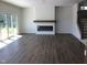 Bright open living room featuring a fireplace and stairs to the second floor at 1404 Malcus Ct # 56, Fuquay Varina, NC 27526