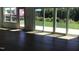 The living room has hardwood floors and lots of natural light from the sliding glass doors at 1404 Malcus Ct # 56, Fuquay Varina, NC 27526