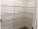A spacious walk-in pantry features plenty of shelving for storing groceries at 1404 Malcus Ct # 56, Fuquay Varina, NC 27526
