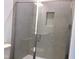 Glass shower stall with built-in shelf, tiled walls, and updated showerhead at 1404 Malcus Ct # 56, Fuquay Varina, NC 27526
