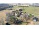A bird's eye view captures the beauty of a home near I-95, surrounded by lush greenery and open fields at 1413 Bud Hawkins Rd, Dunn, NC 28334