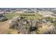 Aerial view of the property surrounded by fields and trees, conveniently located near I-95 at 1413 Bud Hawkins Rd, Dunn, NC 28334