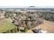 Aerial view of the home and property located in Dunn, NC, surrounded by trees and open fields at 1413 Bud Hawkins Rd, Dunn, NC 28334