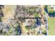An overhead view of a charming home and property with a pool, surrounded by mature trees at 1413 Bud Hawkins Rd, Dunn, NC 28334