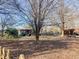 Expansive backyard with a wooden deck, playground, and plenty of space to relax and enjoy the outdoors at 1413 Bud Hawkins Rd, Dunn, NC 28334