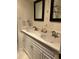 Bathroom with a double sink vanity and dark framed mirror at 1413 Bud Hawkins Rd, Dunn, NC 28334