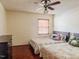 Bedroom with two beds, hardwood floors, a dresser and natural light from the window at 1413 Bud Hawkins Rd, Dunn, NC 28334