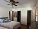 Comfortable bedroom with closet and multiple doors to bathroom at 1413 Bud Hawkins Rd, Dunn, NC 28334