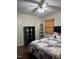Comfortable bedroom featuring a ceiling fan, hardwood floors, and natural light from the window at 1413 Bud Hawkins Rd, Dunn, NC 28334