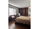 Bedroom featuring a bed, built-in shelving, and a comfortable seating area at 1413 Bud Hawkins Rd, Dunn, NC 28334