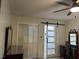 Bedroom featuring a barn door that leads to an ensuite, with a closet and a vanity at 1413 Bud Hawkins Rd, Dunn, NC 28334