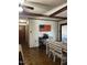 A dining room with a classic wooden table and chairs, featuring wooden floors and white walls at 1413 Bud Hawkins Rd, Dunn, NC 28334