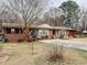 Beautiful single-story brick home featuring a well-manicured front yard at 1413 Bud Hawkins Rd, Dunn, NC 28334