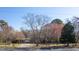 Charming single-story brick home with a well-maintained yard and mature trees at 1413 Bud Hawkins Rd, Dunn, NC 28334
