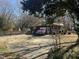 Charming home with a red truck parked in the driveway and well-maintained landscaping at 1413 Bud Hawkins Rd, Dunn, NC 28334