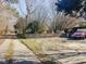 Charming home with a red truck parked in the driveway with a spacious lot at 1413 Bud Hawkins Rd, Dunn, NC 28334