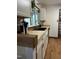 Kitchen featuring butcher block countertops, a black sink, and modern white cabinets at 1413 Bud Hawkins Rd, Dunn, NC 28334