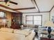 Bright living room features a fireplace, built-in shelving, and natural light from large windows at 1413 Bud Hawkins Rd, Dunn, NC 28334