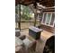 Covered patio with outdoor chairs and fire pit at 1413 Bud Hawkins Rd, Dunn, NC 28334