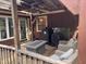 Covered patio with outdoor chairs and fire pit at 1413 Bud Hawkins Rd, Dunn, NC 28334