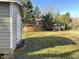 Backyard with storage shed, grass, brick home and wood deck at 1516 Park Ln, Hillsborough, NC 27278