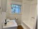 Bathroom features tile flooring, a vanity sink, and a shower/tub combo at 1516 Park Ln, Hillsborough, NC 27278