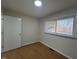 A bright bedroom with hardwood floors and a window with blinds at 1516 Park Ln, Hillsborough, NC 27278