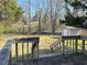 Wooden deck with lawn, mature trees, and storage shed at 1516 Park Ln, Hillsborough, NC 27278