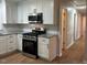 Modern kitchen featuring granite countertops, stainless steel appliances, and subway tile backsplash at 1516 Park Ln, Hillsborough, NC 27278