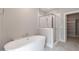 Modern bathroom with soaking tub and glass shower enclosure at 1721 Birdhaven Ln, Wendell, NC 27591