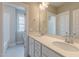 This bathroom has a double sink vanity with stone countertops, and the shower and toilet are separate at 1721 Birdhaven Ln, Wendell, NC 27591
