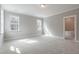 This bedroom is well-lit by two large, trimmed windows at 1721 Birdhaven Ln, Wendell, NC 27591