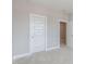 This bedroom has a five panel door and neutral carpeting at 1721 Birdhaven Ln, Wendell, NC 27591