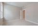Bedroom featuring a window and a five-panel door at 1721 Birdhaven Ln, Wendell, NC 27591
