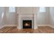 Elegant fireplace with white mantel and decorative tile surround, creating a cozy focal point at 1721 Birdhaven Ln, Wendell, NC 27591