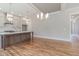 Spacious kitchen with a large center island, pendant lighting, and modern cabinetry at 1721 Birdhaven Ln, Wendell, NC 27591