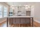Modern kitchen with a large center island, stainless steel appliances, and stylish pendant lighting at 1721 Birdhaven Ln, Wendell, NC 27591