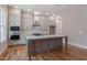 Stylish kitchen featuring stainless steel appliances, custom cabinetry, and a functional center island at 1721 Birdhaven Ln, Wendell, NC 27591