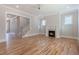 Open living room showcases hardwood floors, fireplace, and ample natural light at 1721 Birdhaven Ln, Wendell, NC 27591