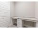 Office space featuring a built-in desk with granite countertop and ample storage at 1721 Birdhaven Ln, Wendell, NC 27591